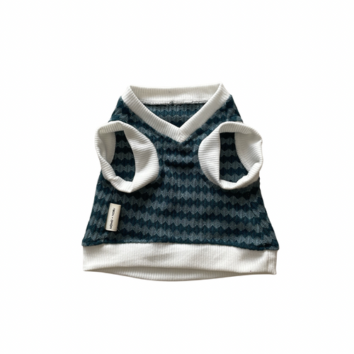 Dog sweater with blue pattern and white trim on a white background
