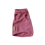 Pink dog sweater with mesh design on a white background