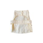 Beige apron with a pocket on a white background