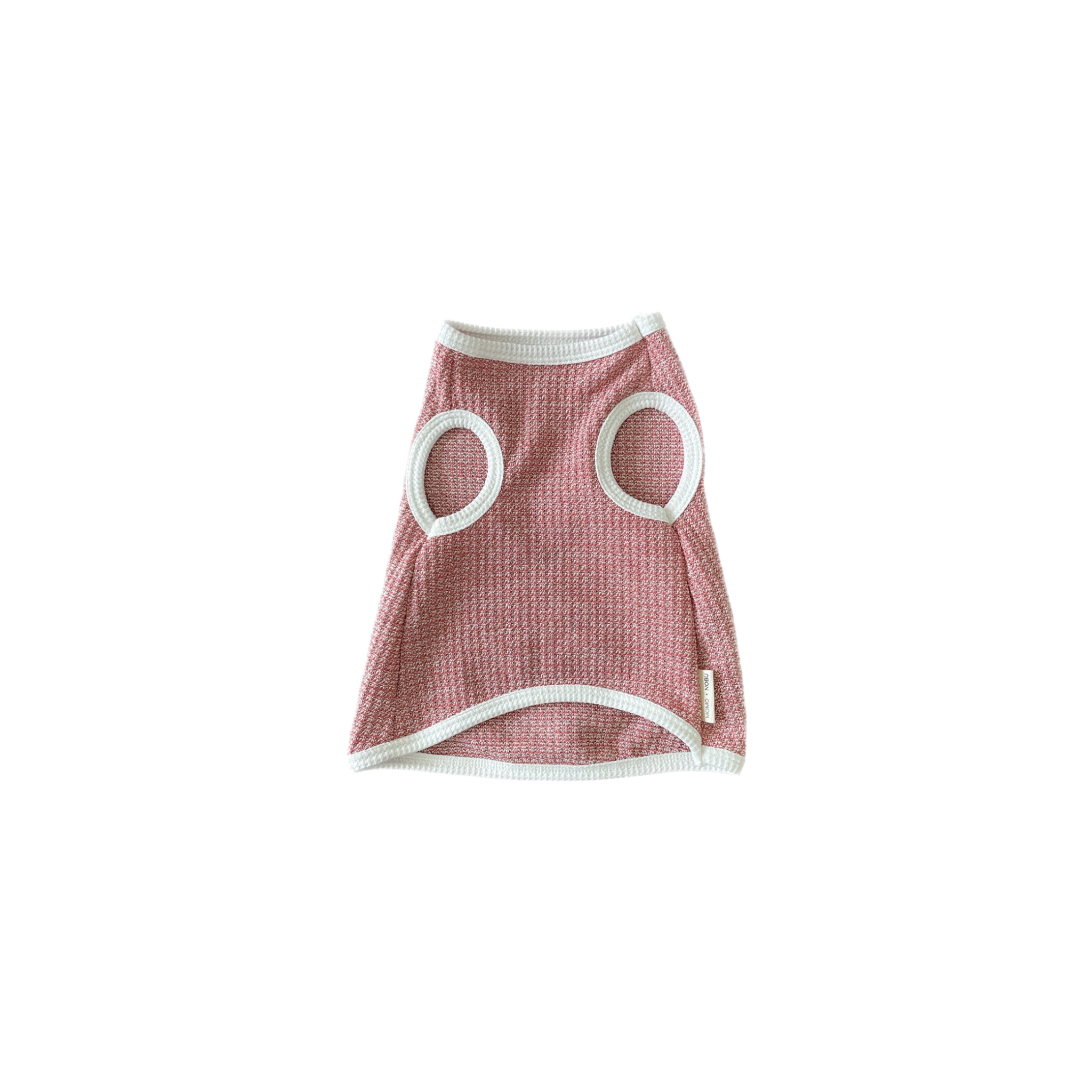 Pink pet dress with circular cutouts on a white background