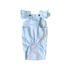 Light blue baby romper with ruffled straps on a white background