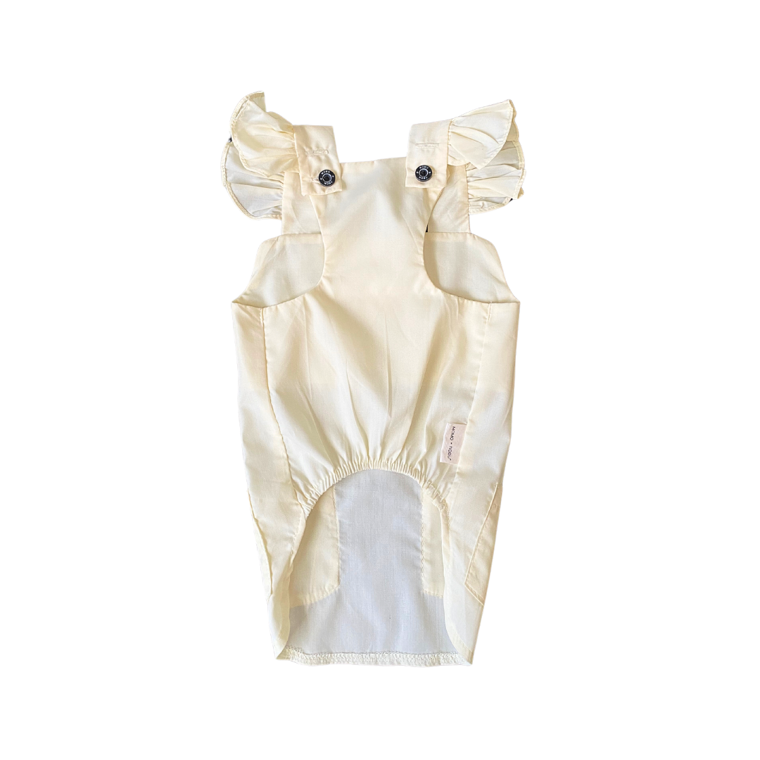 Beige baby romper with ruffled sleeves on a white background