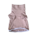 Pink textured dog sweater on a white background