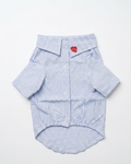 Blue and white striped dog shirt with a red heart label on a white background