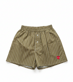 Green striped shorts with a red heart logo on a white background