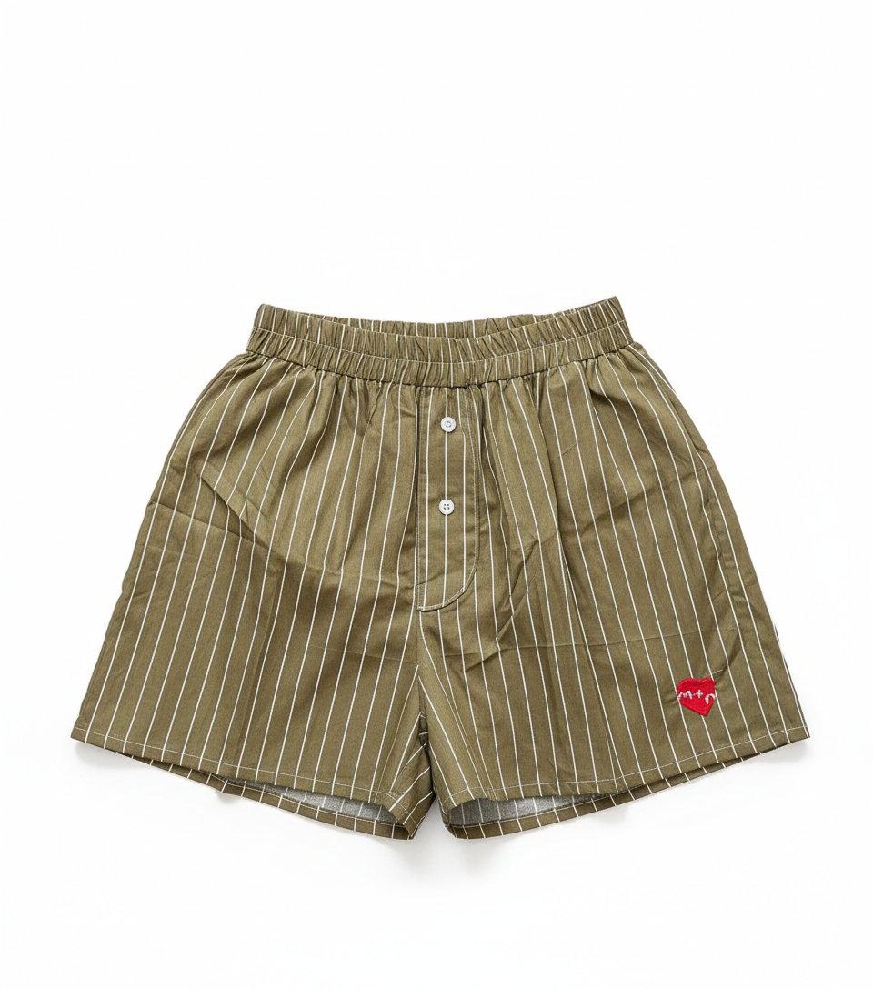 Green striped shorts with a red heart logo on a white background