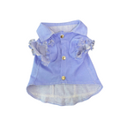 Light blue denim dress with ruffled details on a white background