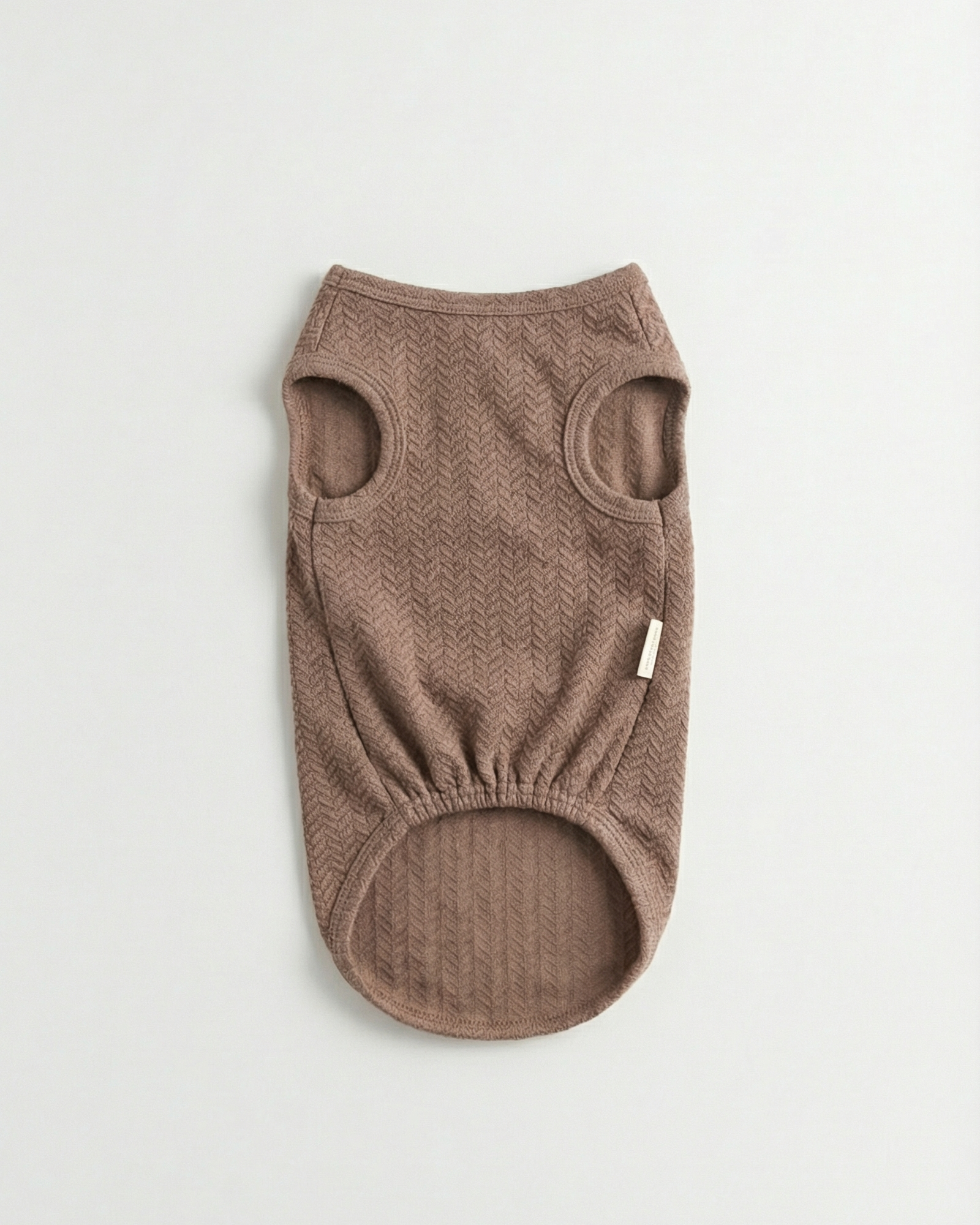 Brown dog sweater on a light gray background