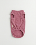 Pink dog sweater on a light gray background