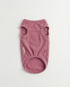 Pink dog sweater on a light gray background