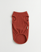 Brown ribbed dog sweater on a light gray background