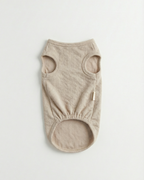 Beige dog vest on a light gray background