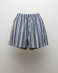Blue and white striped shorts on a light gray background
