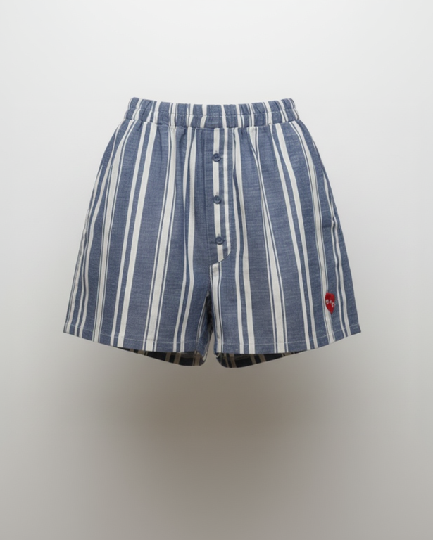 Blue and white striped shorts on a light gray background