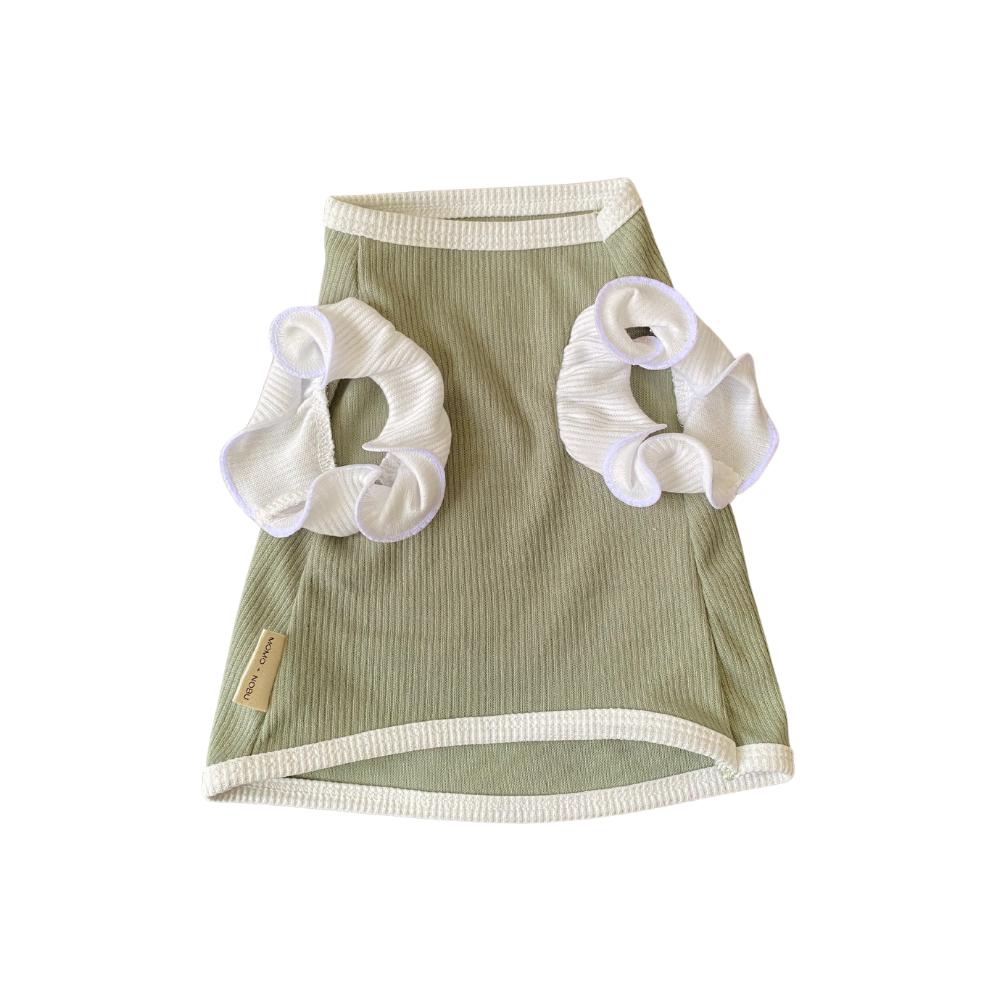 Green pet dress with white ruffled sleeves on a white background