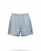 Light blue striped boxer shorts with a red heart logo on a white background