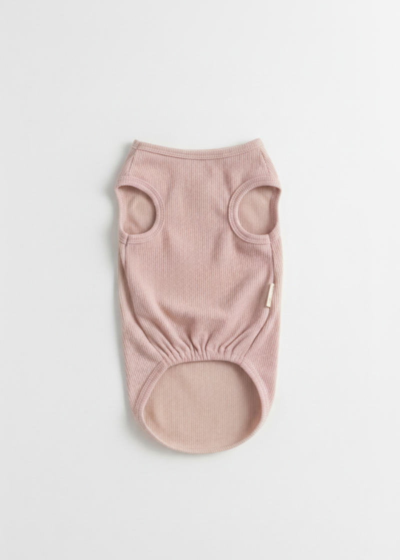 Pink baby romper on a light gray background