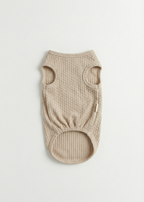 Beige ribbed dog sweater on a light gray background